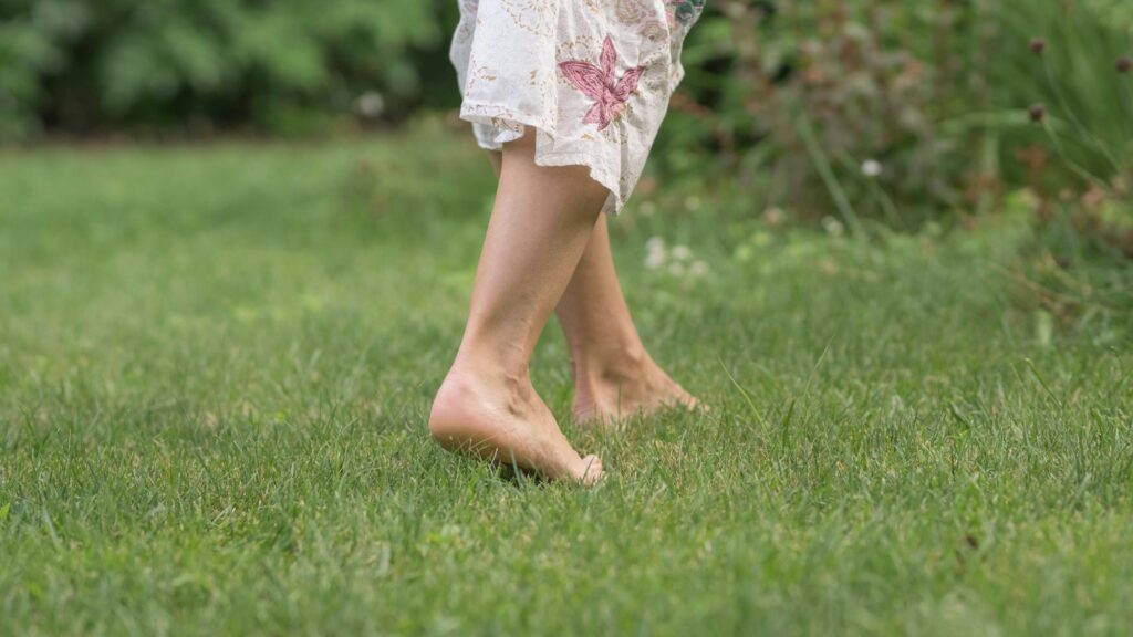 Walking barefoot on the grass